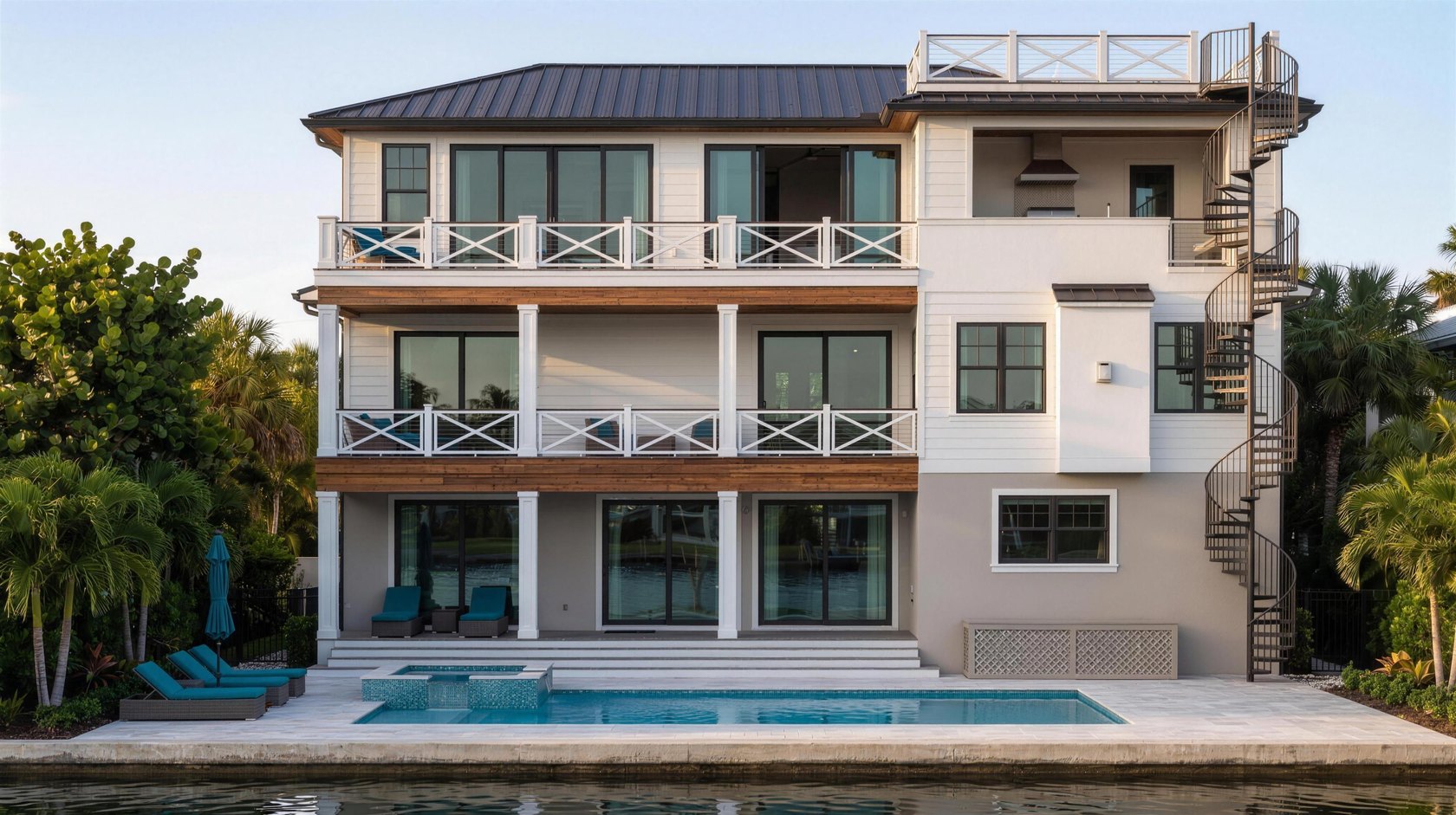 Three story waterfront custom home rear elevation with pool, drafted by Blue Line Drafting